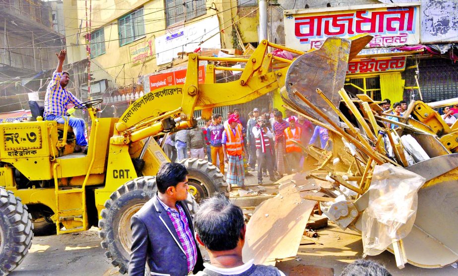 The Dhaka South City Corporation authority conducting eviction drive in city's Gulistan area on Sunday to keep free footpaths from hawkers.