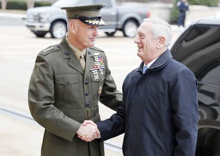Joint Chiefs Chairman Gen. Joseph Dunford greets Defense Secretary James Mattis at the Pentagon.
