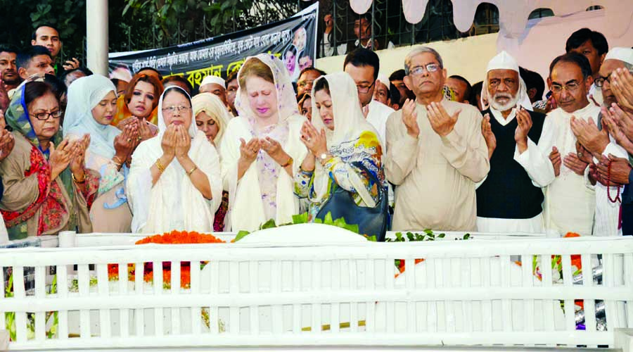BNP Chairperson Begum Khaleda Zia along with the party leaders and activists offering munajat after visiting the grave of her son Arafat Rahman Koko marking Koko's second death anniversary at Banani Graveyard in the city on Tuesday.