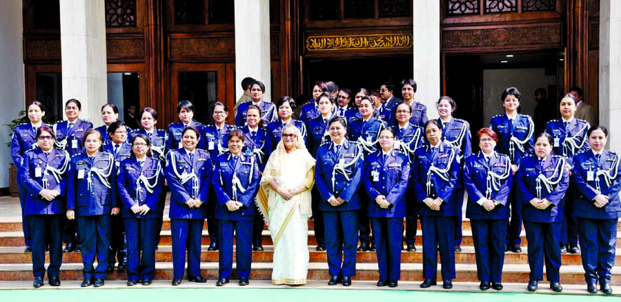 Prime Minister Sheikh Hasina poses for photograph with the high officials of police at her office on Tuesday after delivering her speech on police officials. BSS photo