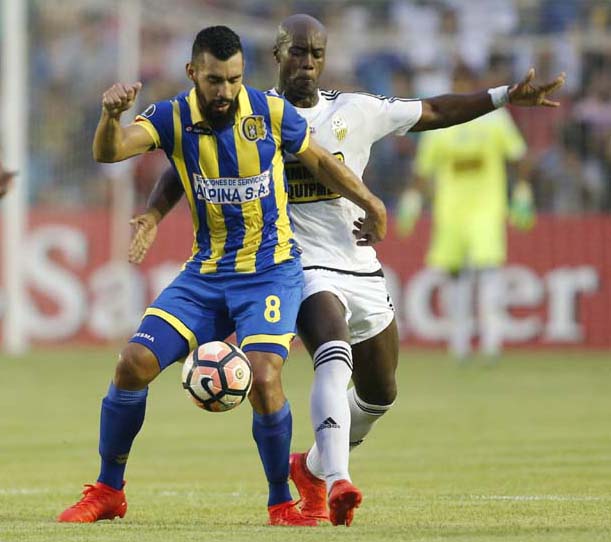 Midfielder Eduardo Ledesma, front of Paraguay's Deportivo Capiata, fights for the ball with midfielder Victor Cordoba of Venezuela's Deportivo Tachira during a Copa Libertadores game in Capiata, Paraguay on Monday.