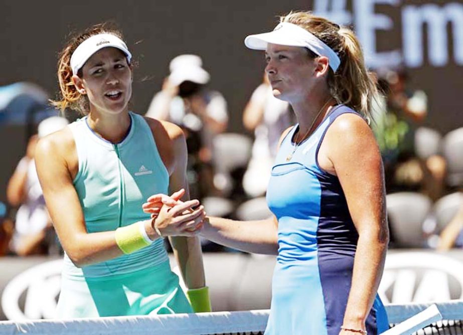 United States' Coco Vandeweghe (right) is congratulated by Spain's Garbine Muguruza after winning their quarterfinal at the Australian Open tennis championships in Melbourne, Australia on Tuesday.