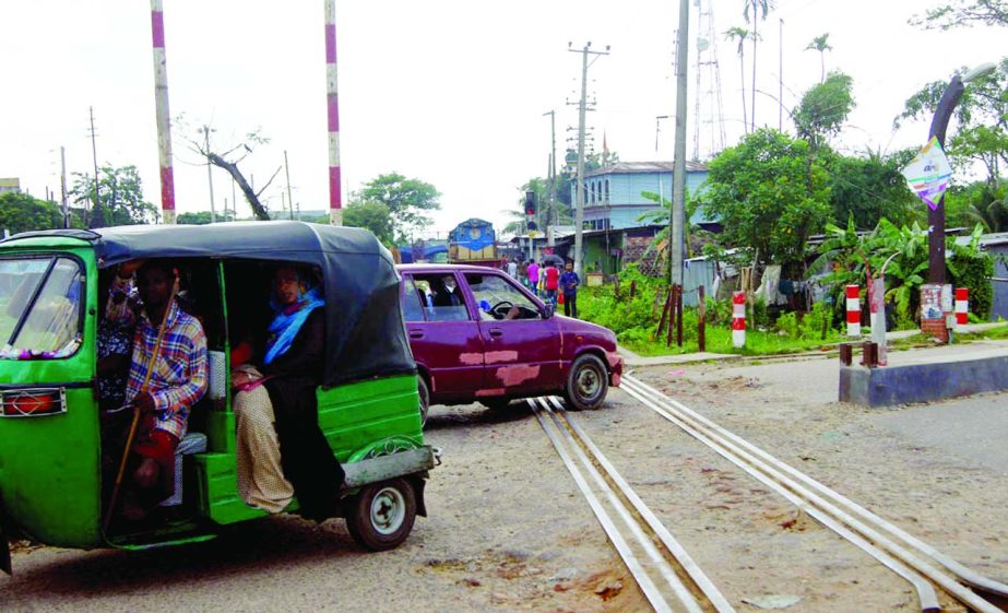 SYLHET: Vehicles moving on Khojharkhola- Kazirbazar Railway crossing at the risk as there was no lineman. This picture was taken yesterday.