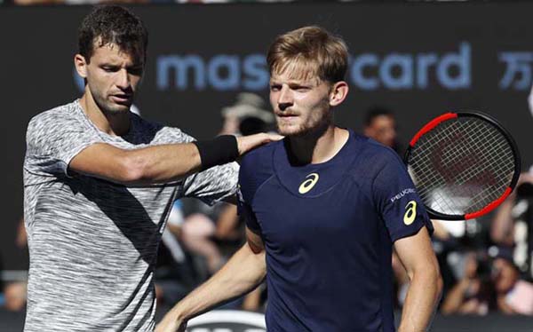 Bulgaria's Grigor Dimitrov (left) consoles Belgium's David Goffin after winning their quarterfinal at the Australian Open tennis championships in Melbourne, Australia on Wednesday.