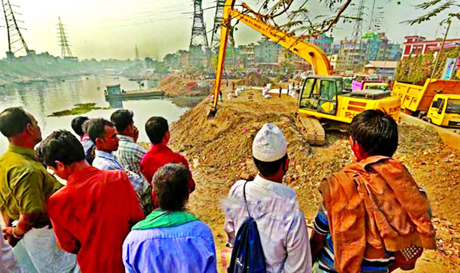 Dhaka South City Corporation authority conducted demolition drive and bulldozed illegal structures over the Mohammadpur Embankment site on Wednesday.