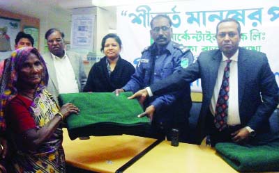 MANIKGANJ: Blankets are being distributed among the poor people donated by Mercantile Bank Ltd, Jhitka Bazar Branch in Harirampur Upazila on Monday.