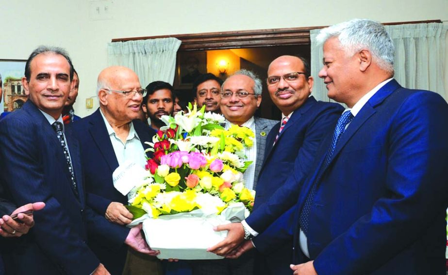 Mohammad Shams-Ul Islam, Managing Director of Agrani Bank Ltd, greeted Finance Minister AMA Muhith with bouquet of flowers on his 84th birth day at his residence in the city recently. Mohammad Ismail Hossain, Md Rafiqul Alam, Deputy Managing Directors and
