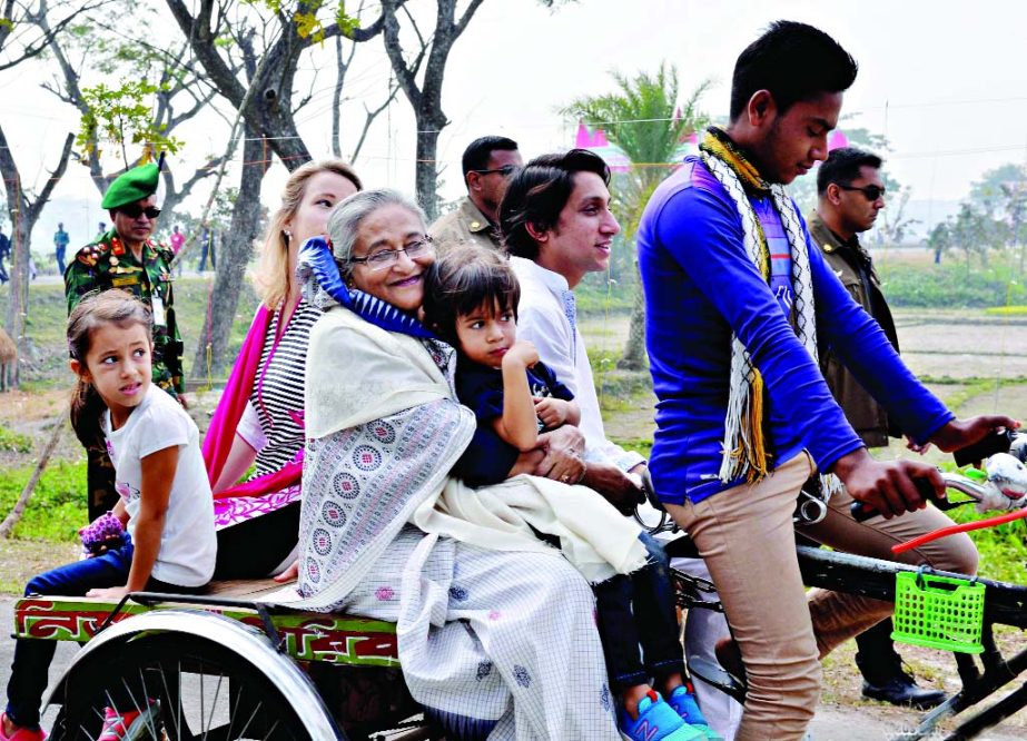 Prime Minister Sheikh Hasina along with her family members visited different areas of Tungipara in Gopalganj boarding on a rickshaw van on Friday.