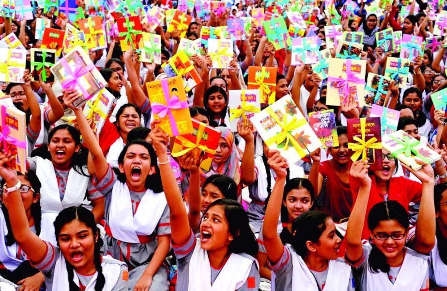 Students of the different educational institutions rejoicing with books at a book festival organised by Bishwa Sahitya Kendra in the city's Suhrawardy Udyan on Friday.