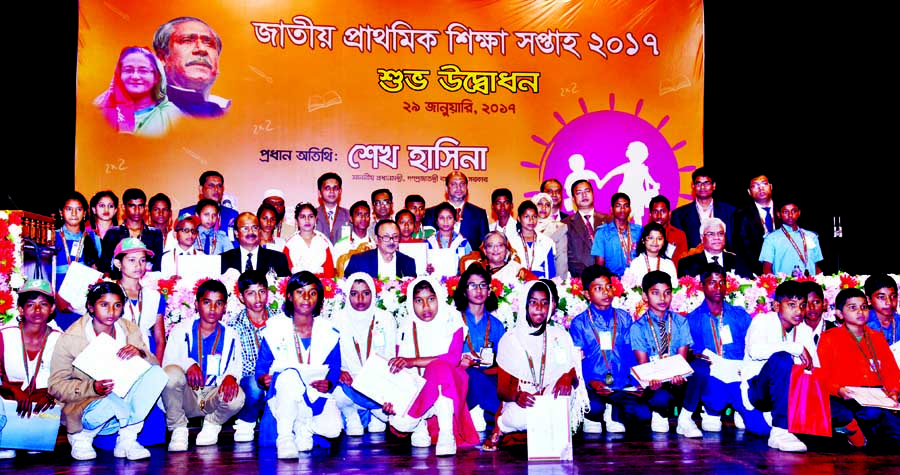 Prime Minister Sheikh Hasina at a photo session with the winners of sports and cultural competition of the country at the Osmani Memorial Auditorium in the city on Sunday on the occasion of National Primary Education Week. BSS photo