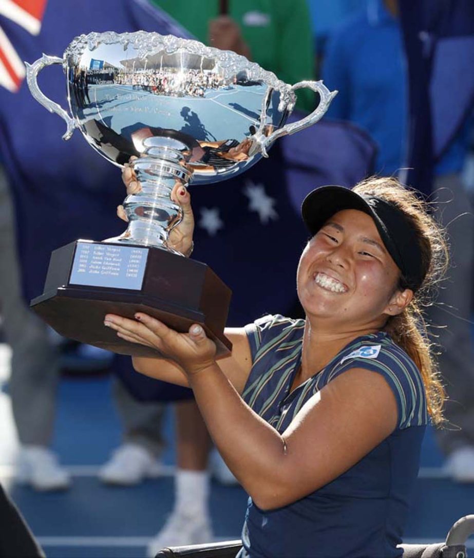 Japan's Yui Kamiji holds her trophy aloft after winning the women's wheelchair singles final against Wiske Griffioen of the Netherlands at the Australian Open tennis championships in Melbourne, Australia on Saturday.