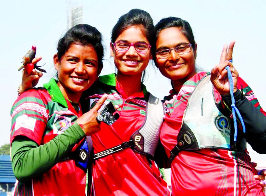 (L-R) Beauty , Radia and Samoly win gold in Recurv team event on Monday.