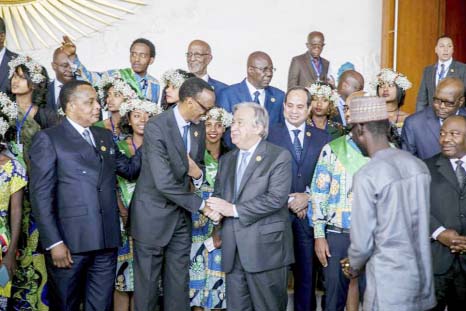 United Nations Secretary-General Antonio Guterres, centre right, shakes the hand of Rwandan President Paul Kagame during the 28th Ordinary Session of the Assembly of the African Union, in Addis Ababa, Ethiopia on Monday