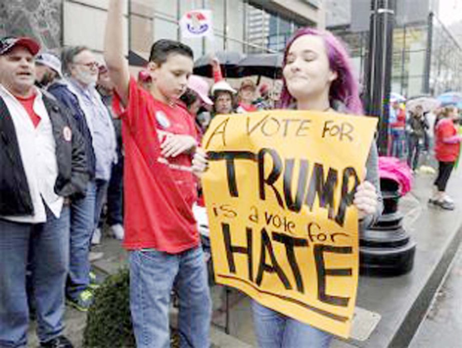 Anti-Trump demonstrators yell slogans during protest against the travel ban imposed by US President Donald Trump's executive order, at Los Angeles International Airport in Los Angeles, California, US.