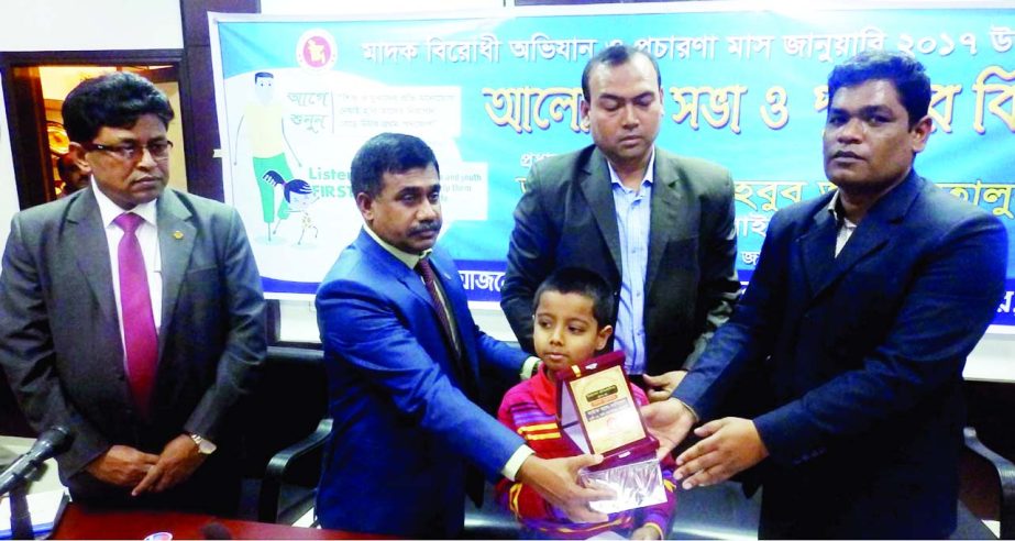 JHENAIDAH: Mahbub Alam Talukder, DC, Jhrenaidah distributing prizes among the winners of Art and Essay competition on anti- drug campaign and publicity month at DC's Conference Room as Chief Guest on Monday.