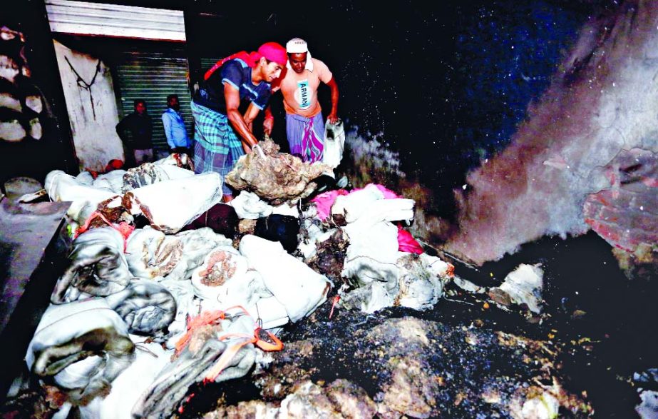 A portion of gutted goods worth crores of taka as fire broke out at Zaker Market in city's Gulistan area on Thursday. This photo was taken on Friday.