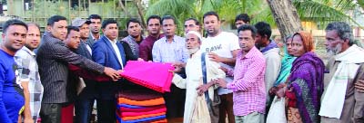 KULAURA (Moulvibazar): Office-bearers of Kulaura United Royals' Club distributing blankets among the cold- hit people at Shaheed Minar premises on Thursday. Among others, A K M Safi Ahmed Salman, Joint General Secretary, Kulaura Upazila Awami League wa