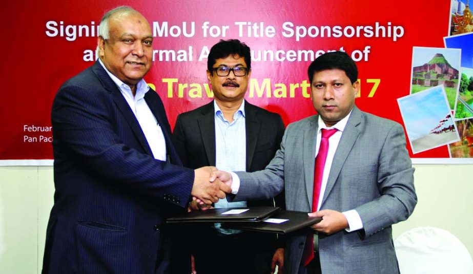 Kazi Wahidul Alam, Editor, The Bangladesh Monitor and Abdullah Al Mamun, Managing Director, US-Bangla Airlines, exchange documents after signed a MoU aimed the upcoming Dhaka Travel Mart 2017 at a city hotel on Saturday. Akhtaruz Zaman Khan Kabir, CEO, Ba