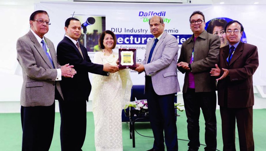 Chairman of Ha-Meem Group AK Azad receiving memento of Daffodil International University (DIU) from Md. Sabur Khan, Chairman, Board of Trustees of DIU at a ceremony held at its auditorium in the city on Saturday.