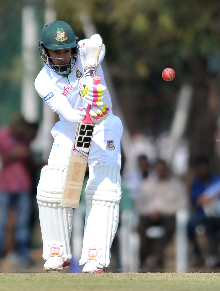 Mushfiqur Rahim gets behind the line and defends on the 1st day of Tour match against India A at Hyderabad on Sunday.