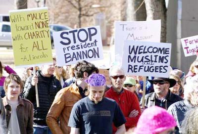 People march to voice their disapproval of U.S. President Donald Trump's policies downtown Boulder, Colorado,