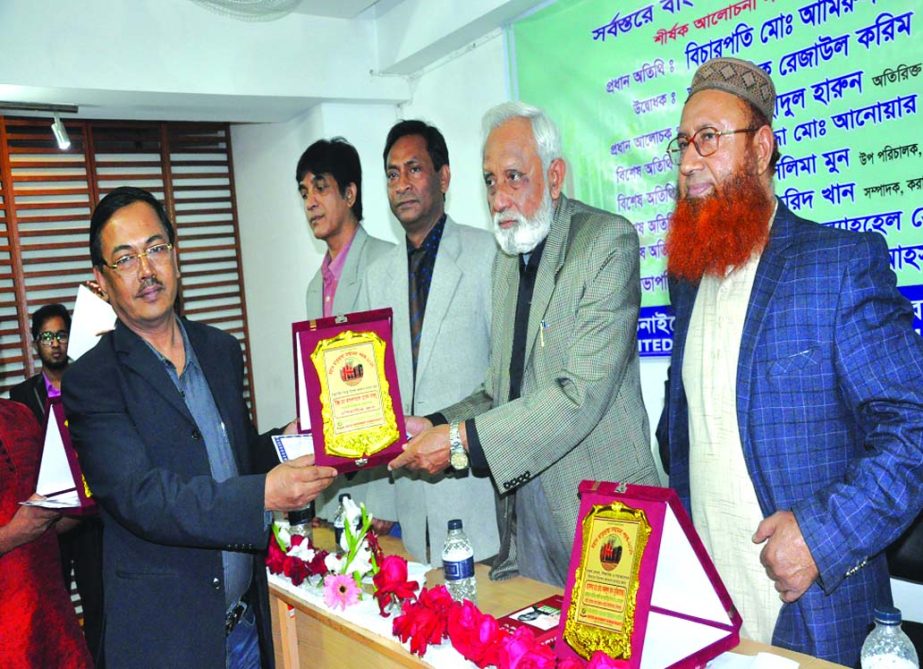 Md Abdullahil (Bablu), Deputy Managing Director of Asiatic Group receiving Mother Language Honorary Award from Language veteran Rejaul Karim in recognition for his contribution to the Textile Industry. United Movement Human Rights organised the award givi