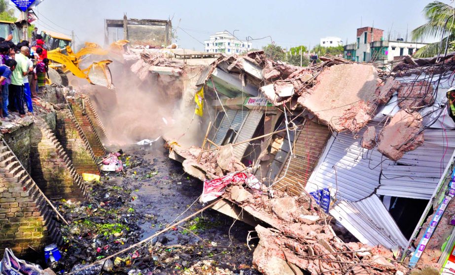Dhaka South City Corporation authority demolishing the establishments illegally built on Nandipara Canal in city on Monday.