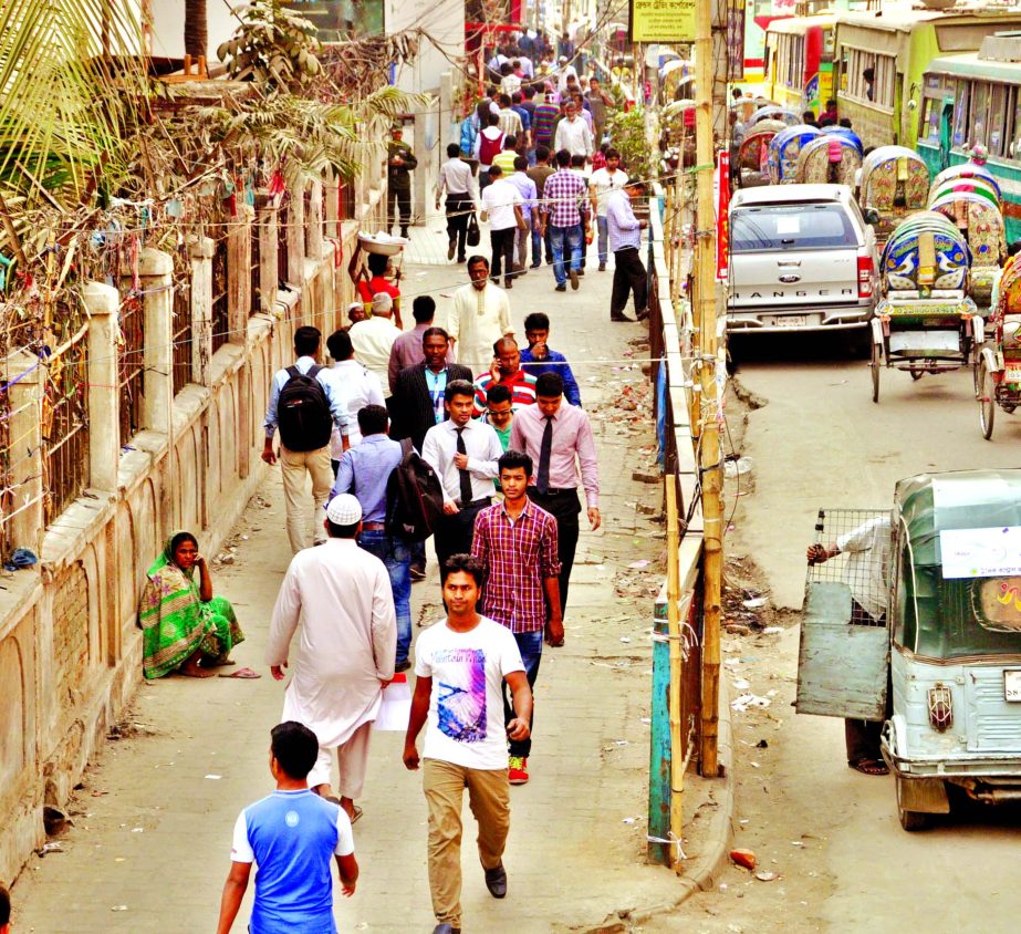 Passing through hawkers-free footpaths has become smooth nowadays as DSCC authorities continue its drive to keep some busy roads clean and walking-friendly. This photo was taken from north side of Baitul Mukarram Mosque at Purana Paltan on Tuesday.