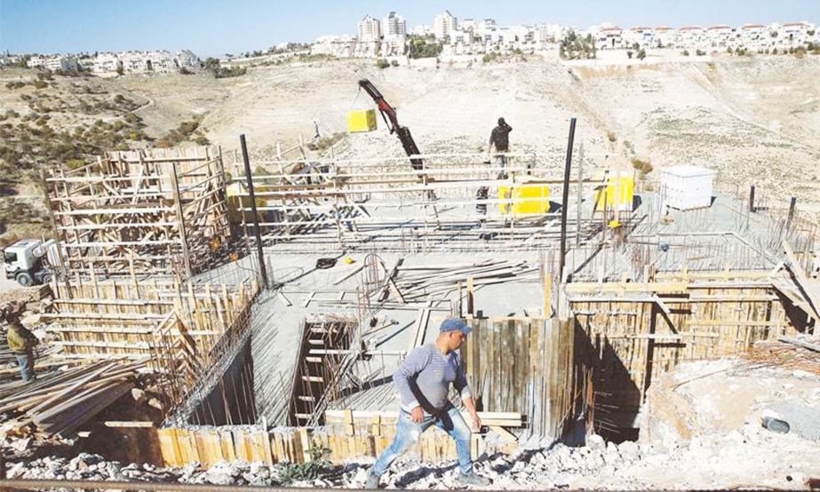 Labourers work at a construction site in the Israeli settlement of Maale Adumim in occupied West Bank on Tuesday.