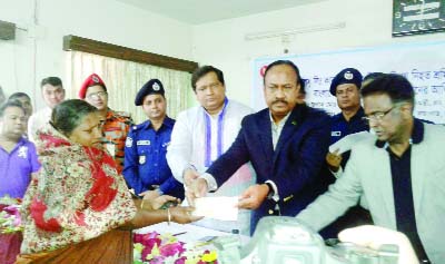 TONGI: State Minister for Labour and Employment Mujibul Haq Chunnu MP distributing cheques among the relatives of the fire victims of Tampaco Foils Ltd at Tongi recently. Among other, Jahid Ahsan Rasel MP was present in the programme.