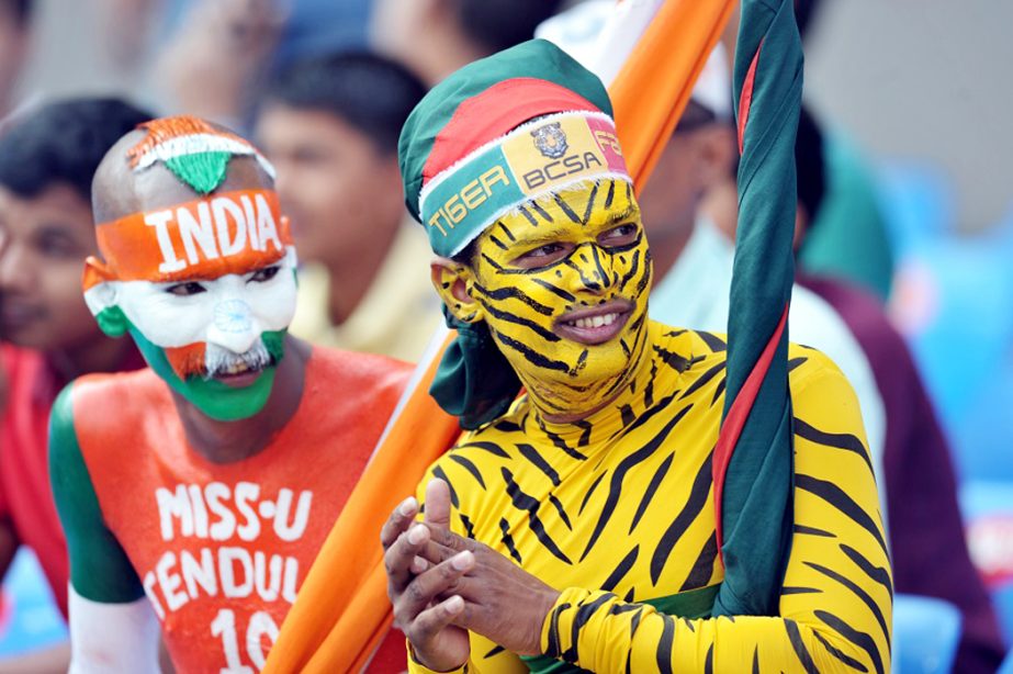 Supporters of Bangladesh and India cheer for their teams during play on the second day of the Test cricket match between India and Bangladesh at the Rajiv Gandhi International Cricket Stadium in Hyderabad on Friday.