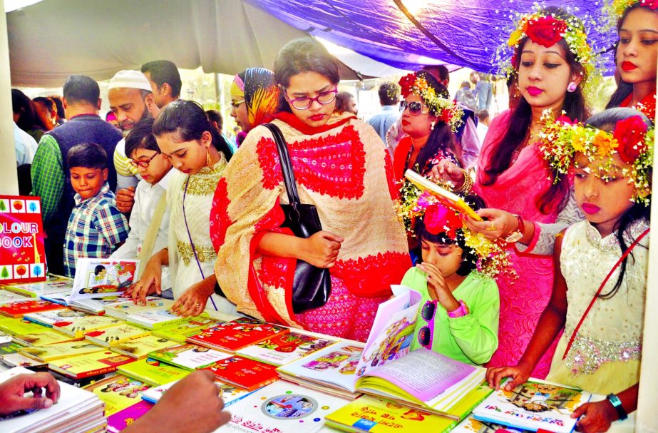 Hundreds of book-lovers including their children thronged the Bangla Academy Book Fair. This photo was taken from Suhrawardy Udyan on Friday.