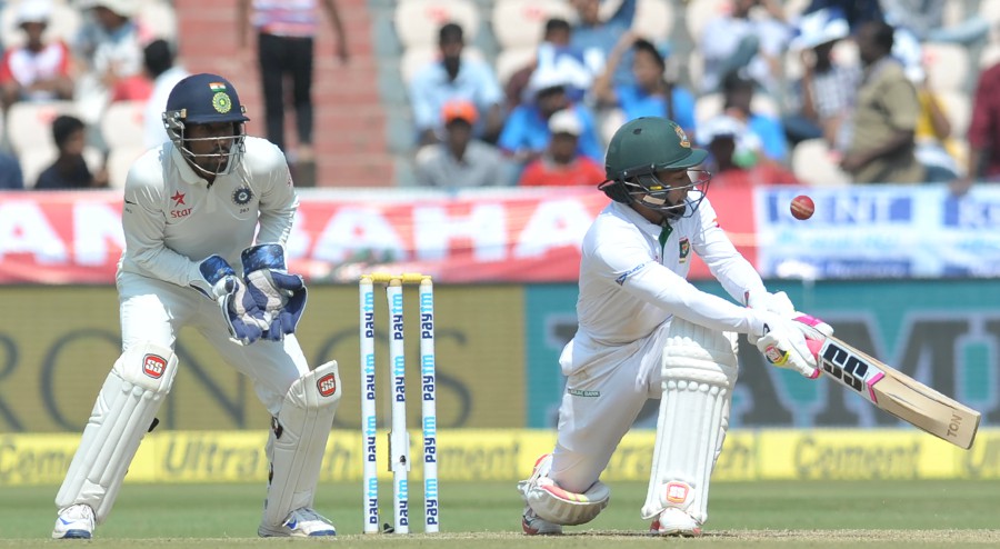 Mushfiqur Rahim attempts a deft sweep on the 3rd day of one-off Test against India at Hyderabad on Saturday.