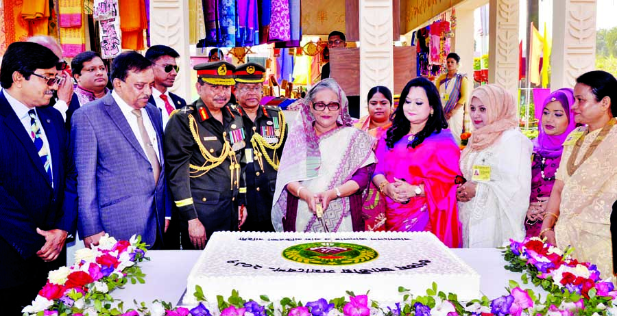 Prime Minister Sheikh Hasina cutting cake at a ceremony organised on the occasion of 37th national conference of Bangladesh Ansar and Village Defence Party at its academy in Shafipur, Gazipur on Sunday. BSS photo