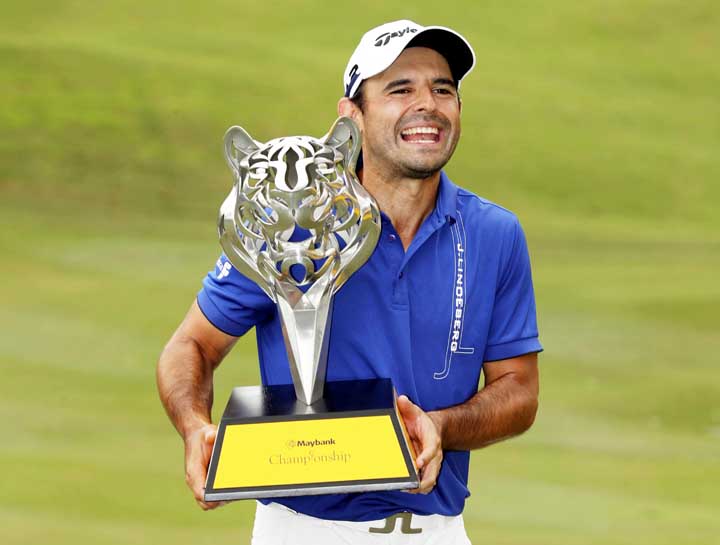 Fabrizio Zanotti of Paraguay poses with his trophy after winning the Maybank Championship golf tournament in Kuala Lumpur, Malaysia Sunday.