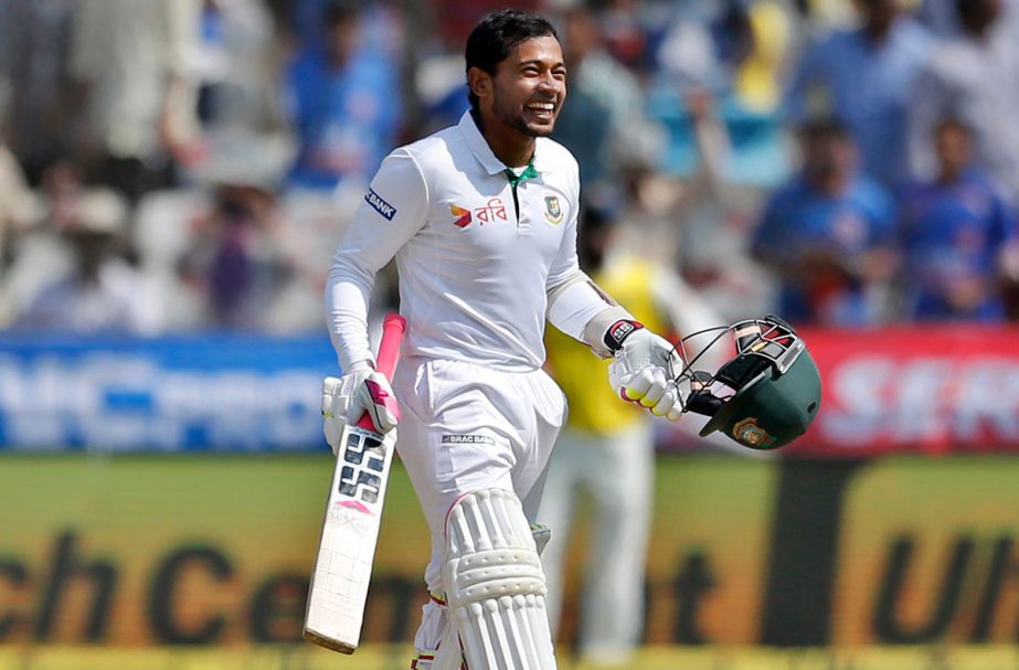 Mushfiqur Rahim grins after completing his hundred on the fourth day of the cricket Test match against India in Hyderabad on Sunday. (News on Page 1)