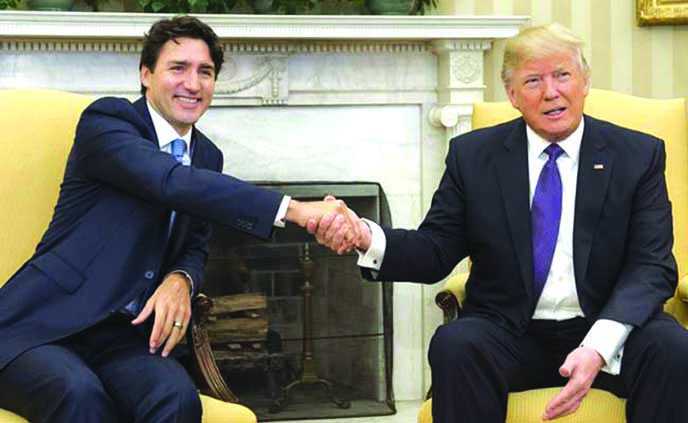 US President Donald Trump (l) shaking hands with Canada;s Prime Minister Justin Trudeau at White House in Washington.