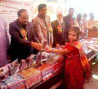 Prof Dr Md. Nurul Islam of Social Welfare and Research Institute of Dhaka University distributing prizes among the students of Al-Hera International School of Narayanganj district. The event was organized to celebrate the sixth anniversary of the school.