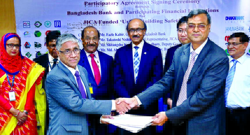 Ahmed Kamal Khan Chowdhury, Managing Director of Prime Bank Ltd (PBL) and Swapan Kumar Roy, General Manager, SME and Special Program Department of Bangladesh Bank (BB) exchange documents after signed participatory agreement of JICA sponsored Urban Buildin
