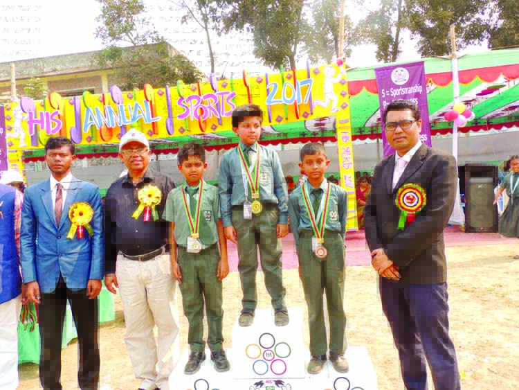 Principal of Heed International School Tolbart Dobey along with the students at the annual sports competition held recently at the playground of the school in the city's Pallabi, Mirpur.