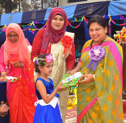Tasneem Esrar, President of BAFWWA Central Committee and Chairperson of BAFWWA Golden Eagle Nursery giving away prizes among the winners at School premises in the city on Tuesday.