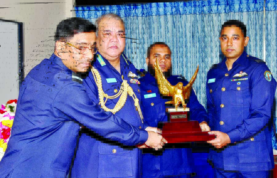 Chief of Air Staff Air Chief Marshal Abu Esrar giving away the prestigious 'Mofiz Trophy' to Squadron Leader Md Ehteshamul Haque GD (P) for his best all-round performance in No 52 Flying Instructors' Course of BAF at Flying Instructors' School , BAF,
