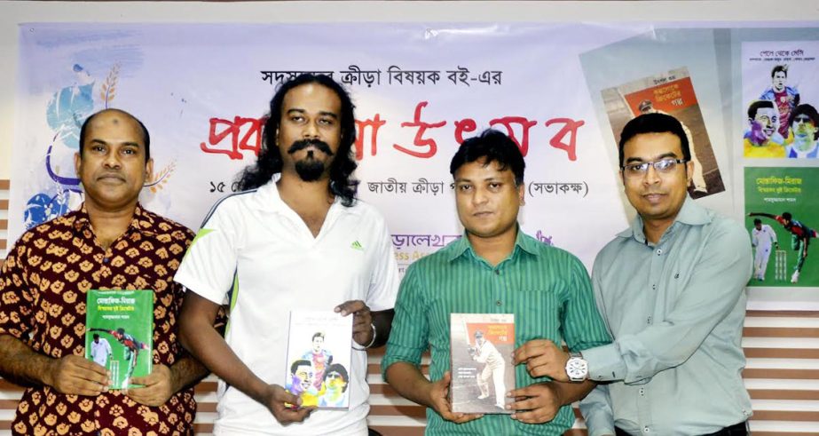 The book writers of Bangladesh Sports Press Association (BSPA) and the officials of BSPA pose with the books at the auditorium of National Sports Council on Wednesday. BSPA organized a publication ceremony for members' sports related books.