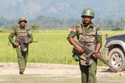Armed Myanmar army soldiers patrol a village in Maungdaw located in Rakhine State.