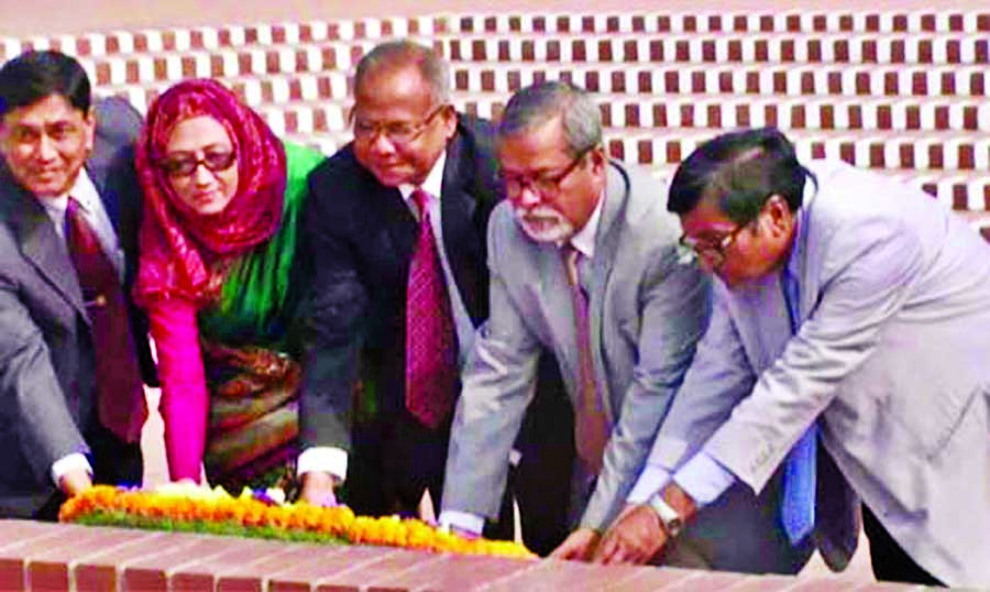 Newly appointed election commissioners led by its Chief KM Nurul Huda placing floral wreaths on Savar National Memorial on Thursday.