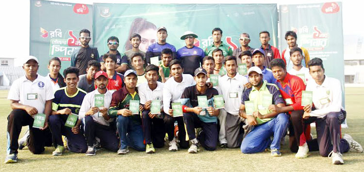 The selected spinners of 'Khoj The Number One Spinner' with the coaches pose for a photo session at the Zahur Ahmed Chowdhury Stadium in Chittagong on Wednesday. Robi and BCB have jointly organized the nation-wide programme.