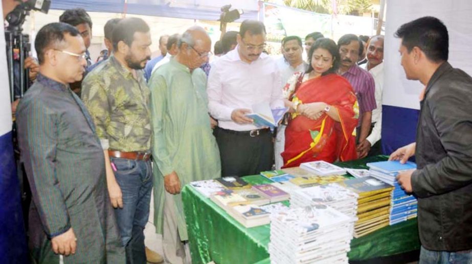 CCC Mayor A J M Nasir Uddin visiting a book stall at Ekushey Book Fair at Muslim Institute Hall premises on Thursday.