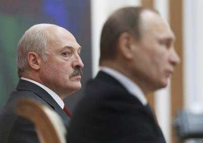 Belarusian President Alexander Lukashenko, left, and Russian President Vladimir Putin attend the talks in Minsk, Belarus.