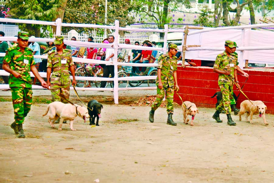 Law enforcers scanning the Central Shaheed Minar area with dog squad for security reason ahead of 'Amor Ekushey' and also International Mother Language Day. The snap was taken on Sunday.