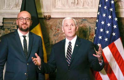 US Vice President Mike Pence poses with European Union foreign policy chief Federica Mogherini in Brussels, Belgium on Monday.